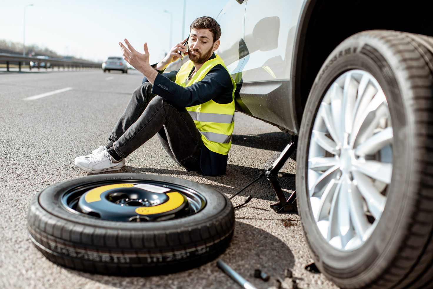 Man Calling Road Assistance on the Highway