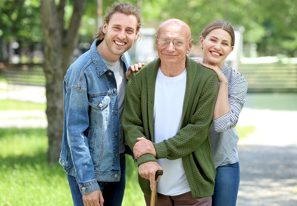 Elderly Man with His Relatives in Park